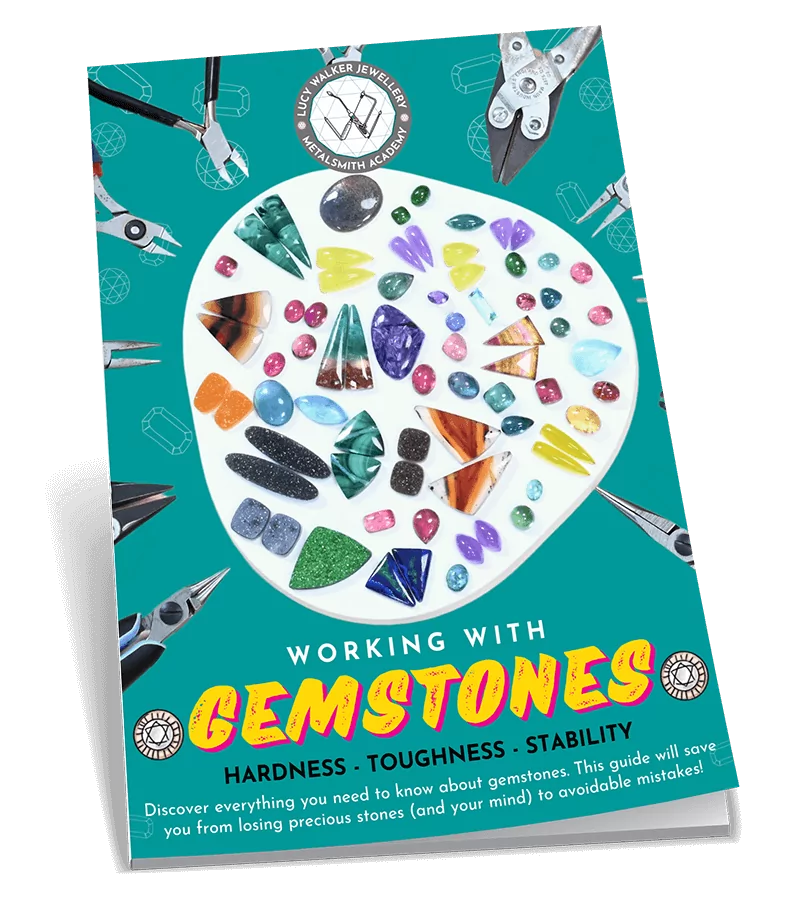 Book titled "Working with Gemstones" featuring assorted gemstones on the cover. From a guide on natural gemstones for jewelry making